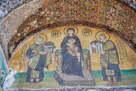 Byzantine mosaic of Virgin Mary  holding the infant Jesus.Constantine offers the city of Constantinople and Justinian the Hagia Sophia church at Istanbul,Turkey