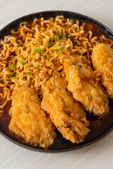 Korean instant noodles with fried chicken or Fried chicken ramyeon