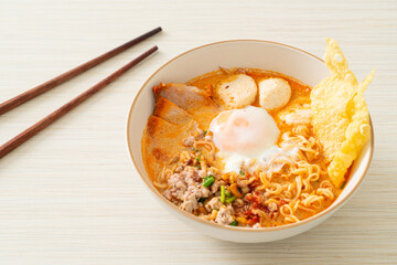 instant noodles with pork and meatballs in spicy soup