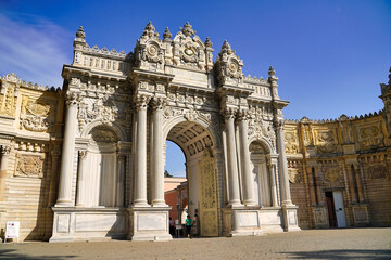 The Imperial Entrance Gate of the Dolmabahce Palace, built in 1856 as a imperial palace for the last of the Ottoman sultans in Istanbul, Turkey - obrazy, fototapety, plakaty