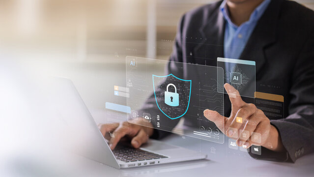 Network cybersecurity and privacy using artificial intelligence to safeguard data. AI technology is being used by a businessman to protect data management and information to cyberattacks.