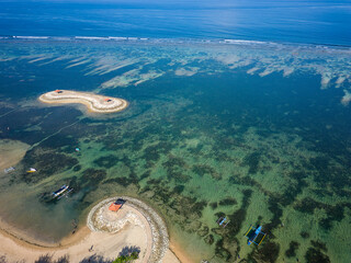 Aerial view of the offshore gazebo and protective fringing coral reef at Sanur on the Indonesian island of Bali