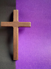 Lent Season, Holy Week, Good Friday, Easter Sunday Concept. Close up of wooden cross with black and...