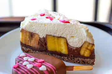 Chocolate Banoffee Pie on white plate.