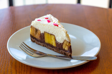 Chocolate Banoffee Pie on white plate.