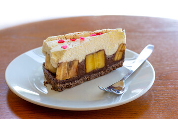 Chocolate Banoffee Pie on white plate.