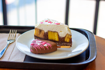 Chocolate Banoffee Pie on white plate.