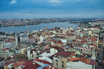 Evening View of the Golden horn waterway between Eminonu and Galata districts as seen from the top of Galata Tower in Istanbul, Turkey