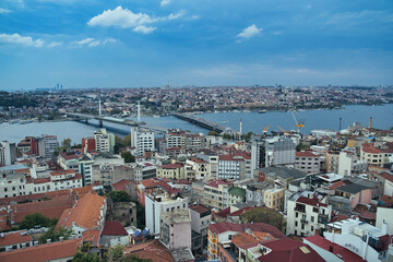 Ataturk bridge and metro bridge over the golden horn waterway between Eminonu and Galata districts as seen from the top of Galata Tower in Istanbul, Turkey