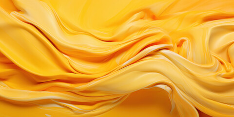 Dynamic abstract background of vivid yellow fabric in fluid motion, suggesting energy and vibrancy.