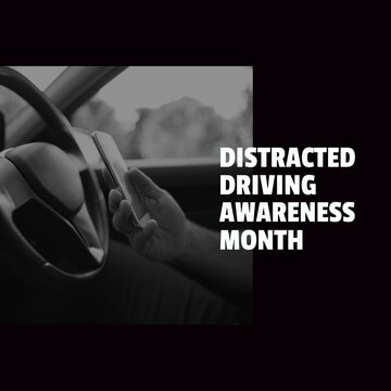 Fototapeta Composition of distracted driving awareness month text over caucasian man using smartphone in car