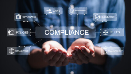 Compliance rules law regulation policy business. Businessman hold virtual compliance icons for enforcement of laws, regulations, and standards. - obrazy, fototapety, plakaty