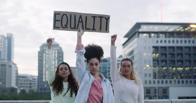 Women, poster and protest in city for equality, human rights or stop gender based violence. Portrait of female people, group or activist with cardboard banner, placard or sign for empowerment