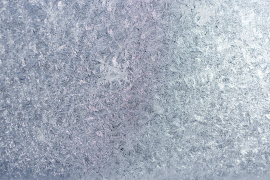 Full frame macro abstract texture background of an ice frosted glass window pane, with copy space
