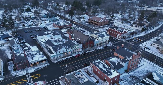 Early evening winter aerial video of the four corners in the Village of Pittsford, New York. (01-14-2024)