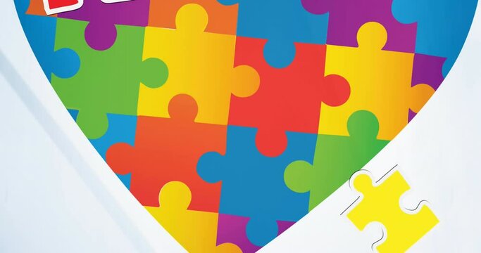 Animation of autism awareness month puzzle pieces and heart on white background