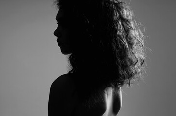 Beautiful Woman with curly Hair. Female silhouette - obrazy, fototapety, plakaty