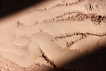 Background of brown sandy powder. concept of beauty, texture and cosmetics mock up