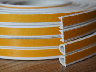 Door and window rubber seal strip. Various types of self-adhesive rubber gasket. Sealing tape for...