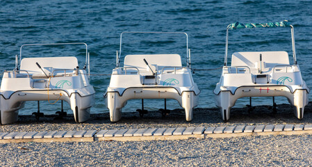 Catamarans stand on the seashore