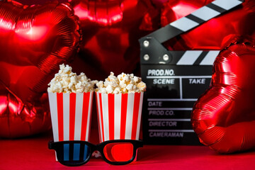 A banner for the film industry. A romantic movie date. A movie camera, 3D glasses, popcorn and...