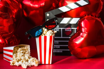 A banner for the film industry. A romantic movie date. A movie camera, 3D glasses, popcorn and...