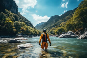 Canyoning extreme sport. canyoning expedition, popular trails, hard impressive spot. Man Exploring a wild untamed river canyon. Energy, freedom and adrenaline, back view.