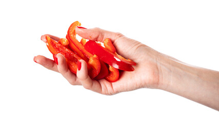 Red sweet bell pepper slices in hand isolated on a white background. Woman holding bulgarian pepper. Healthy food and ingredients concept
