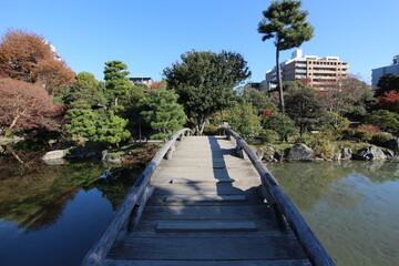 Ingetsu Pond, Shinsetsu Bridge and autumn leaves in Shosei-en Garden, Kyoto, Japan