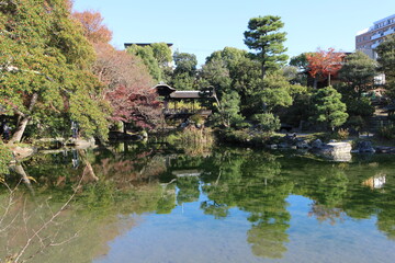 Fototapeta na wymiar Ingetsu Pond, Kaitourou (roofed corridor) and autumn leaves in Shosei-en Garden, Kyoto, Japan