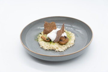 Embracing the elegance of simplicity, this dish showcases the creamy richness of perfectly cooked risotto, complemented by earthy mushrooms and a light, airy foam.