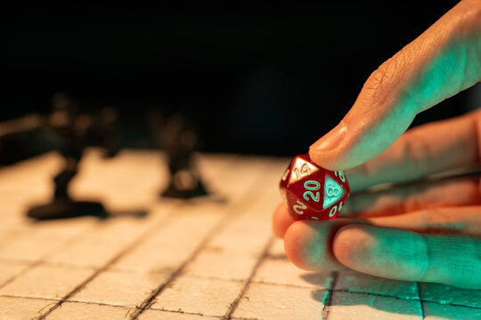 Playing a fantasy tabletop role-playing game with a D20 dice