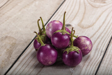 Raw small purple asian baby eggplant