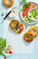 Top view of of tasty bagels with filling of salmon and vegetables