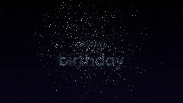 Happy birthday greeting with explosive fireworks on the starry night sky background. Silver stars forming the words Happy Birthday