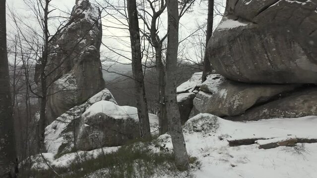 ancient cave monastery in the Carpathians in Bubnyshche, Ukraine, which is hundreds of years old, and the Dovbush rocks are millions of years old. Time lapse with clouds that symbolize transience