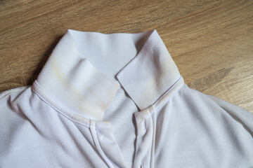 Dirty sweat stain on collar of shirt from long using in daily life. stain for cleaning concept.