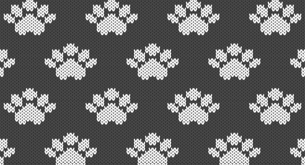 White animal paw prints on grey knitted pattern, Festive Sweater Design. Seamless Knitted Pattern © Aoiiz