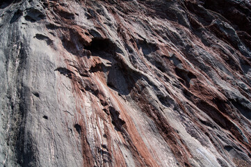 Red stones, blue sky, green water