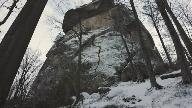 ancient cave monastery in the Carpathians in Bubnyshche, Ukraine, which is hundreds of years old, and the Dovbush rocks are millions of years old. Time lapse with clouds that symbolize transience