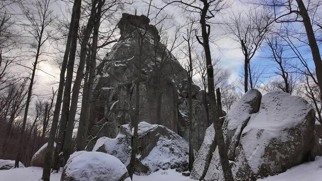 ancient cave monastery in the Carpathians in Bubnyshche, Ukraine, which is hundreds of years old, and the Dovbush rocks are millions of years old. Time lapse with clouds that symbolize transience