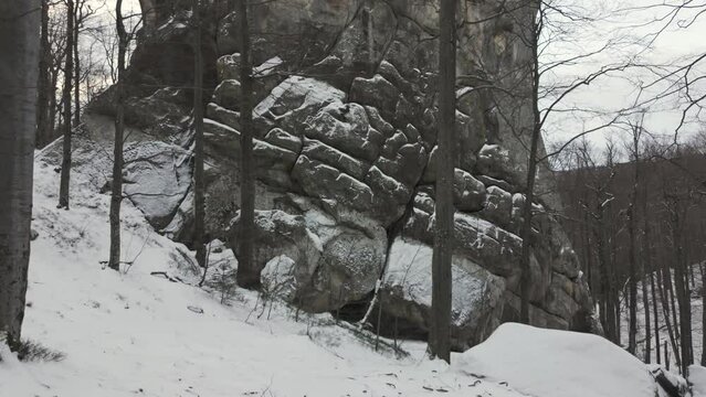 ancient cave monastery in the Carpathians in Bubnyshche, Ukraine, which is hundreds of years old, and the Dovbush rocks are millions of years old. Time lapse with clouds that symbolize transience