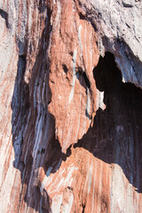 Red stones, blue sky, green water