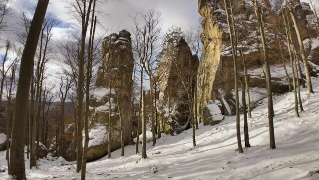 ancient cave monastery in the Carpathians in Bubnyshche, Ukraine, which is hundreds of years old, and the Dovbush rocks are millions of years old. Time lapse with clouds that symbolize transience