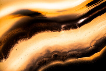 yellow and black tainted agate macro photography detail texture. close-up polished semi-precious...