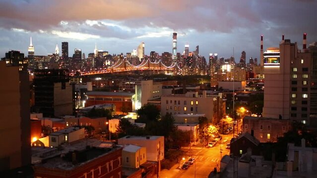 Illuminated Queensboro bridge, Queens area at night in New York
