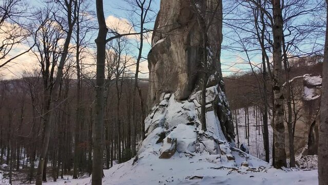 ancient cave monastery in the Carpathians in Bubnyshche, Ukraine, which is hundreds of years old, and the Dovbush rocks are millions of years old. Time lapse with clouds that symbolize transience