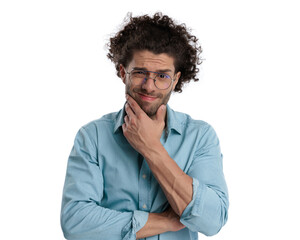 pensive casual man holding his chin