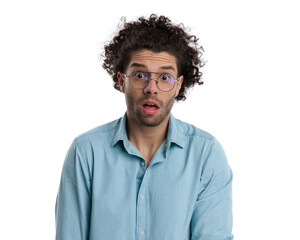 closeup of shocked casual man with curly long hair