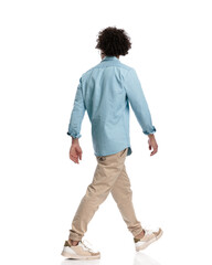 casual man stepping to side and looking behind